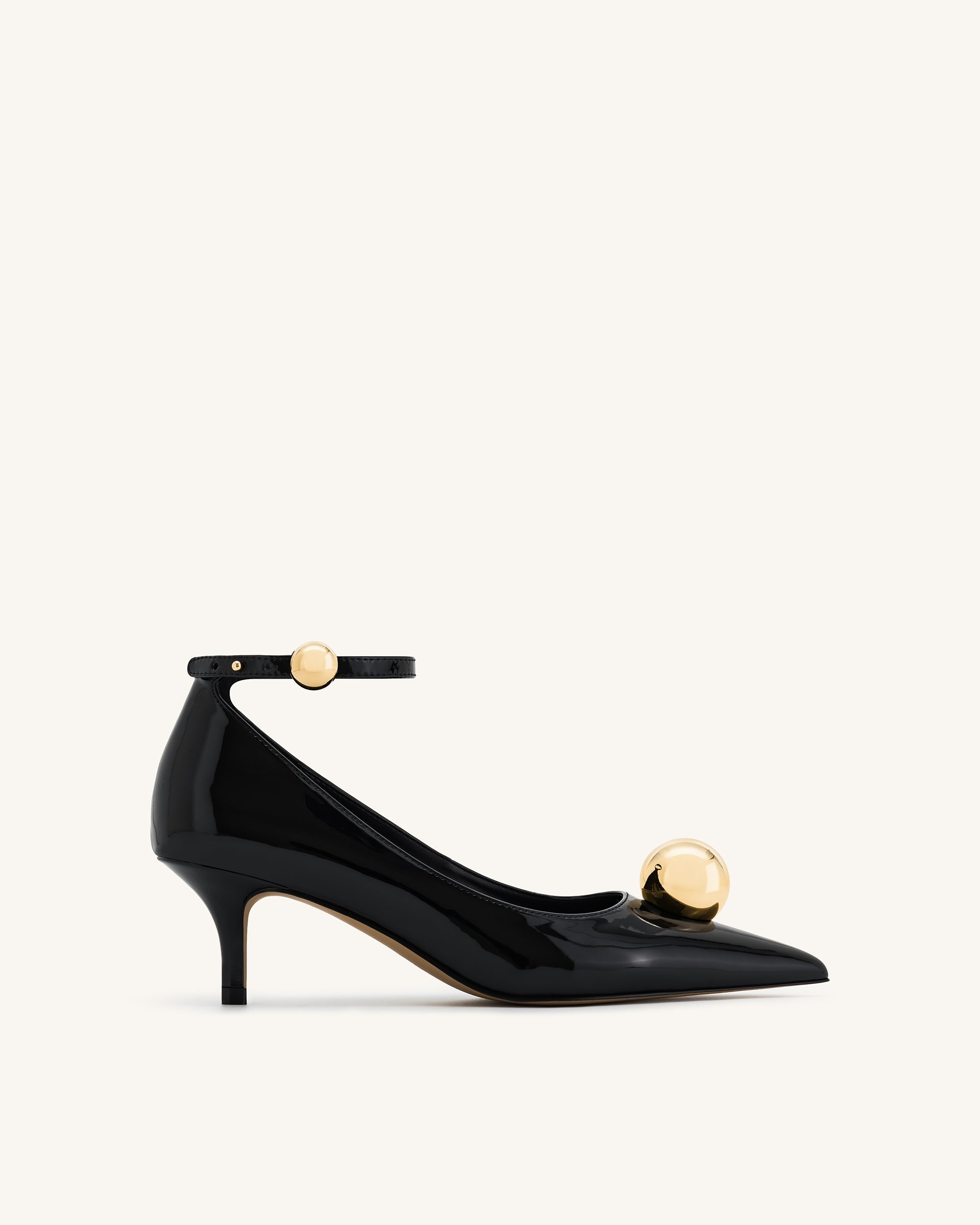 Black orders and gold kitten heel shoes